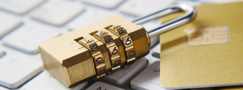 Photo of a gold-colored combination lock on a keyboard